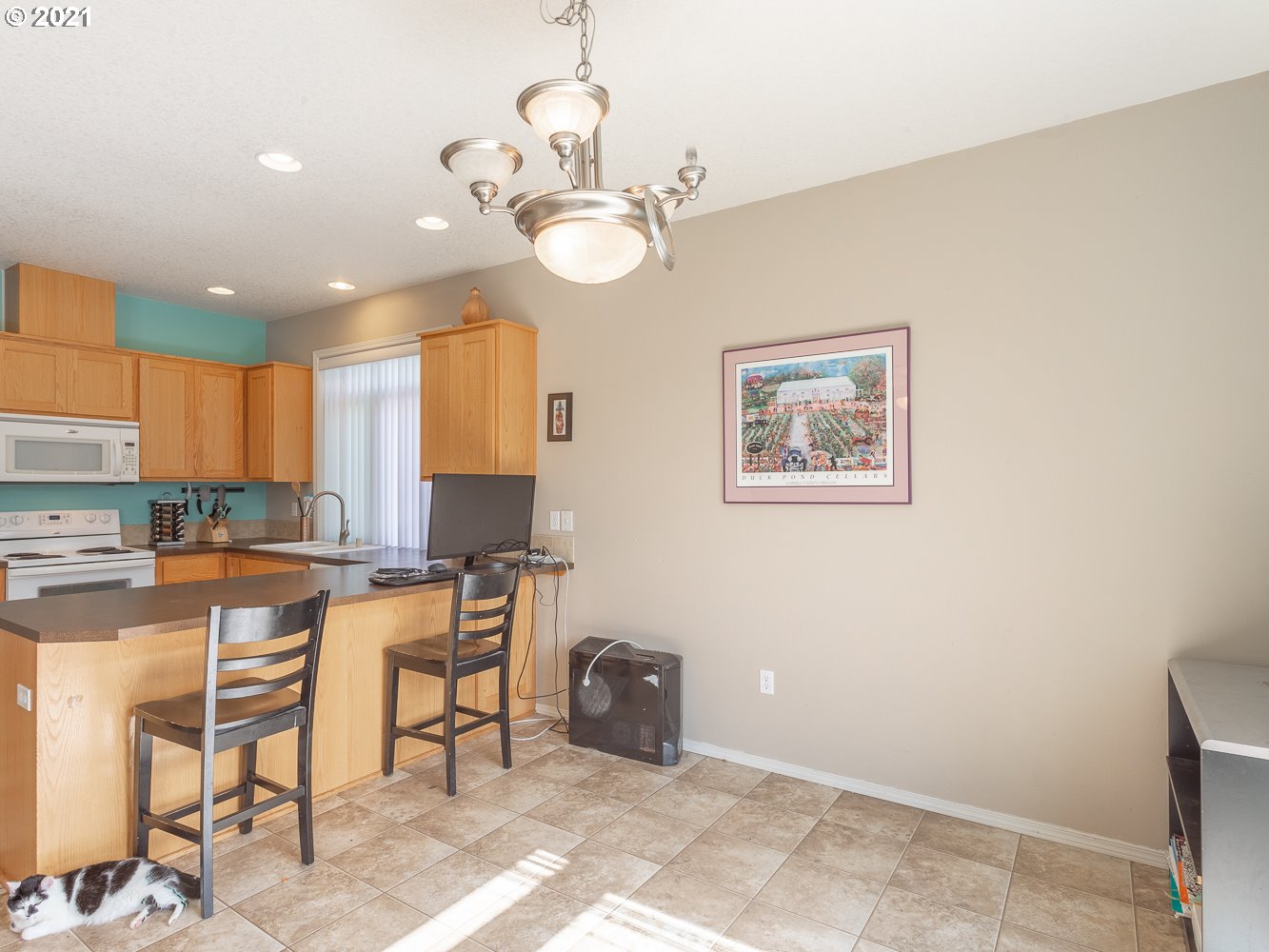 3123 South 2nd Street Ridgefield, WA 98642 - Photo 8 of 32 a view of a kitchen with dining table and chairs
