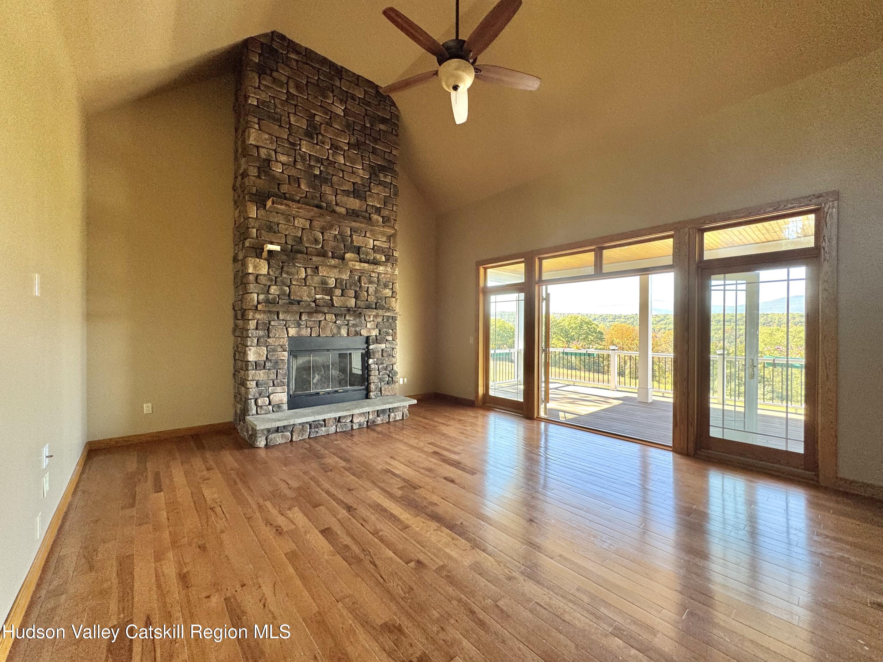 3071 Old Kings Road Catskill, NY 12414 - Photo 17 of 53 a view of an empty room with a window and wooden floor