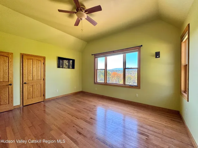 a bathroom with a granite countertop shower a sink and toilet