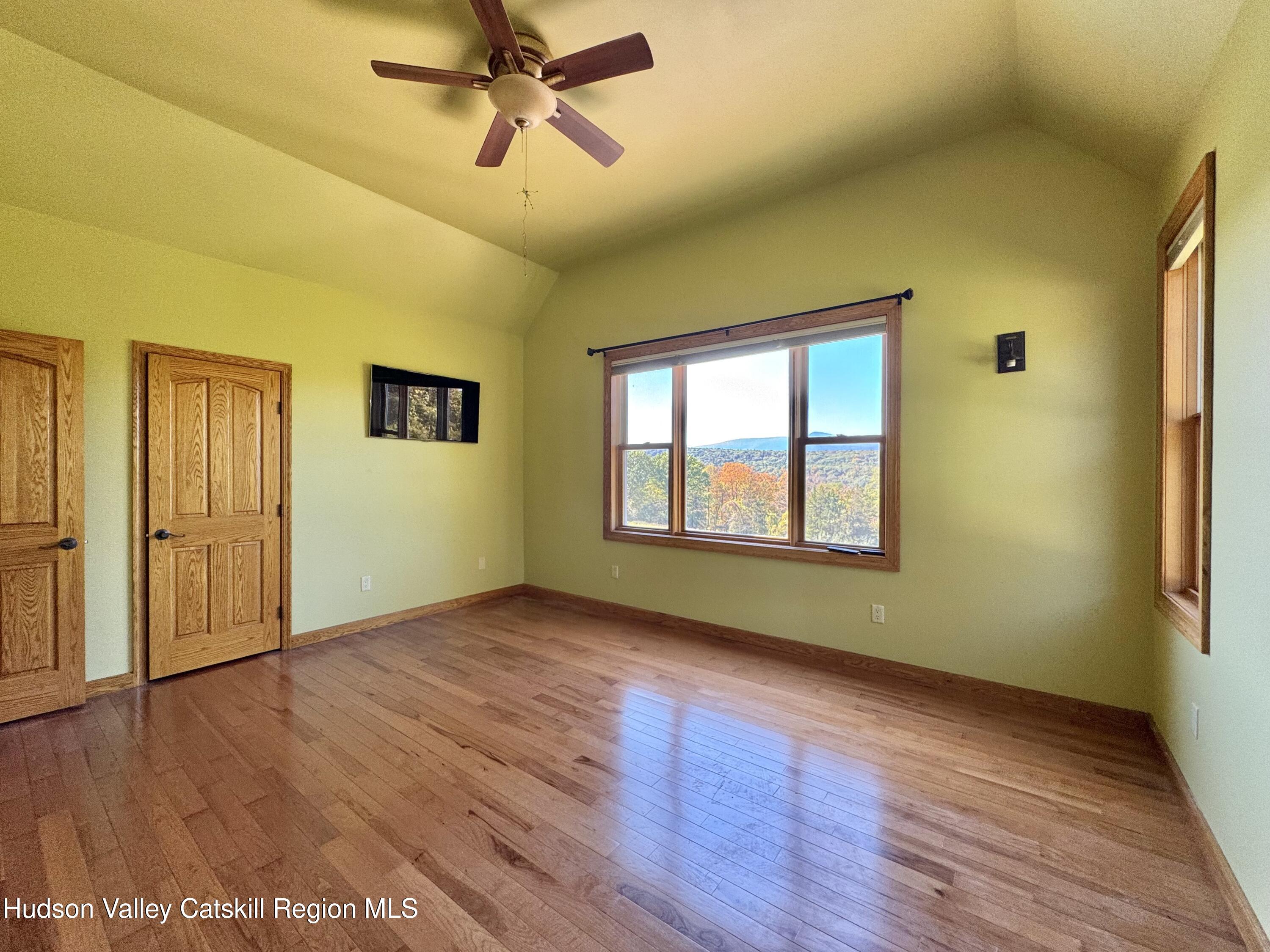 3071 Old Kings Road Catskill, NY 12414 - Photo 31 of 53 a view of empty room with wooden floor and fan