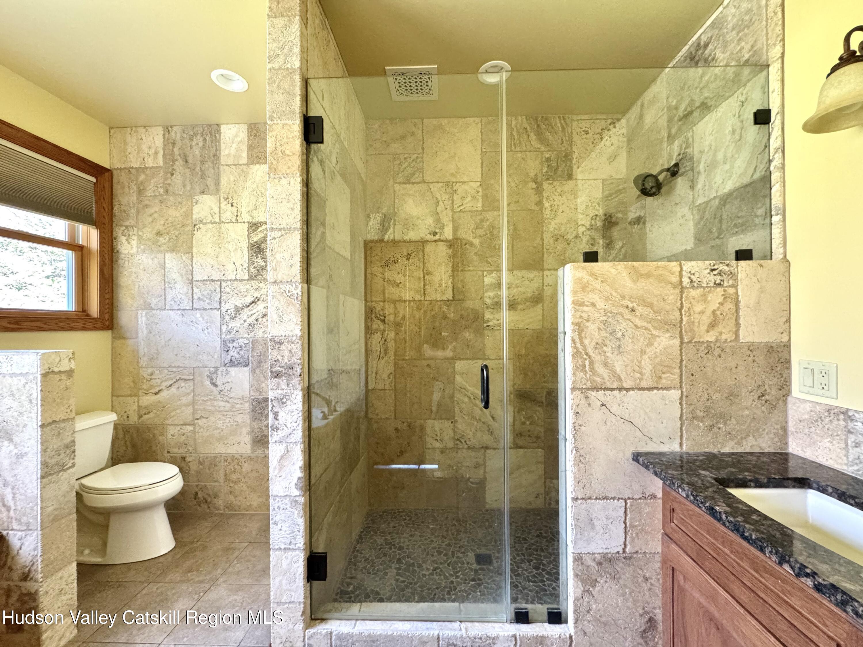 3071 Old Kings Road Catskill, NY 12414 - Photo 33 of 53 a bathroom with a granite countertop shower a sink and toilet