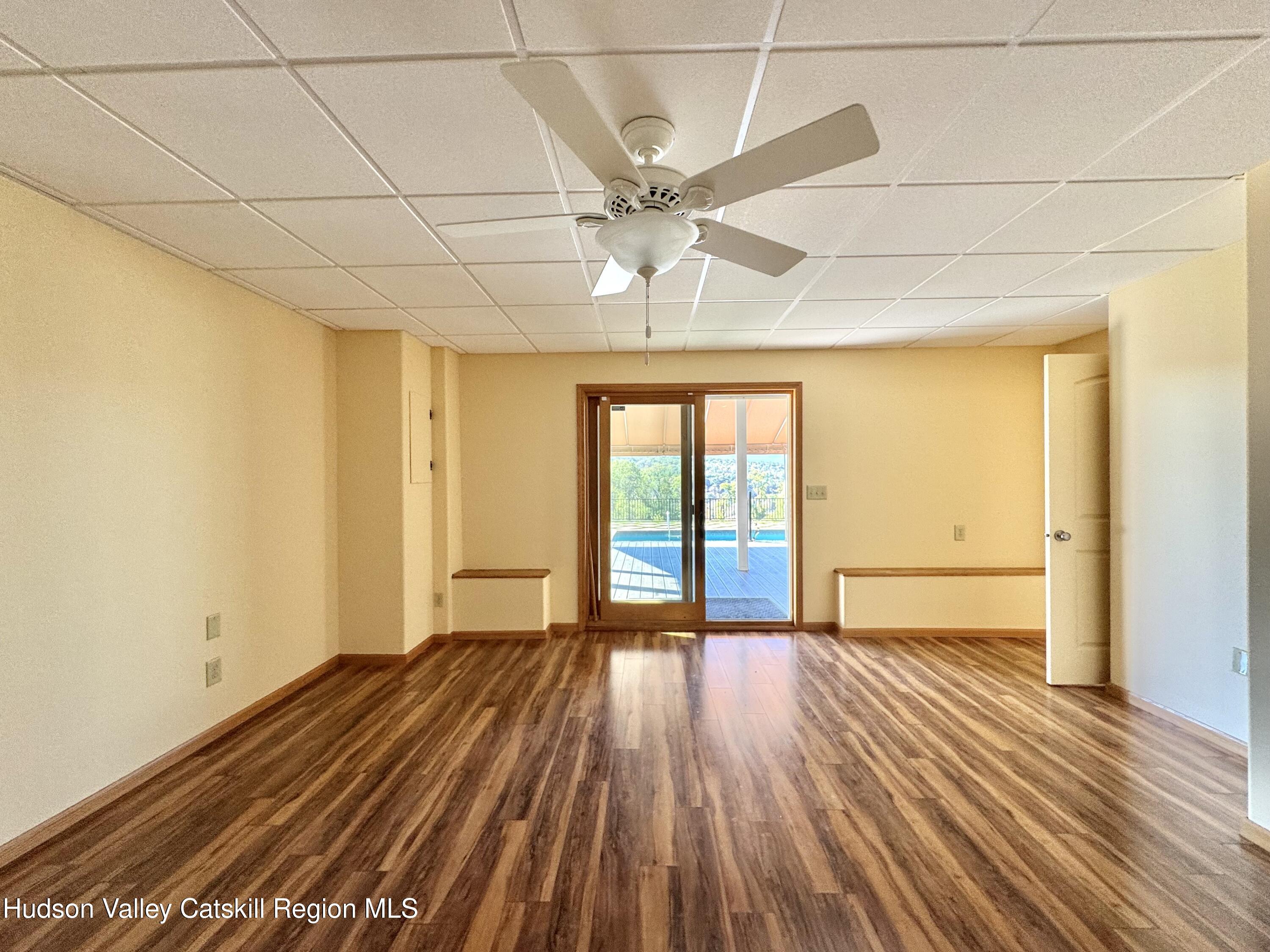 3071 Old Kings Road Catskill, NY 12414 - Photo 41 of 53 a view of an empty room with a window and wooden floor