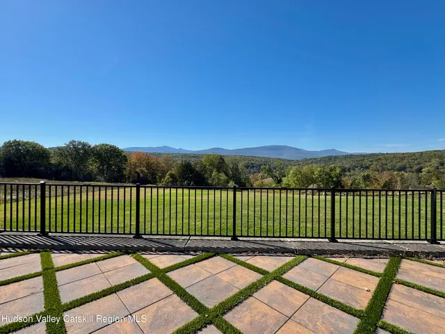 swimming pool view with sitting space and garden view