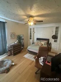 a bedroom with furniture and a chandelier