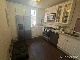 a kitchen with a sink stove and refrigerator