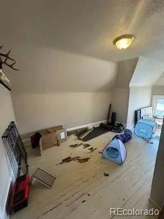 a view of a bedroom with bed and couch