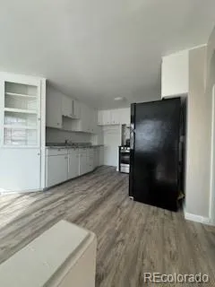 a kitchen with stainless steel appliances a refrigerator and a sink