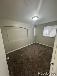 an empty room with a empty space and windows