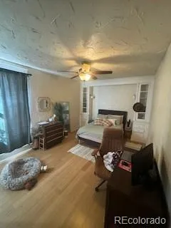 a living room with furniture a rug and a chandelier