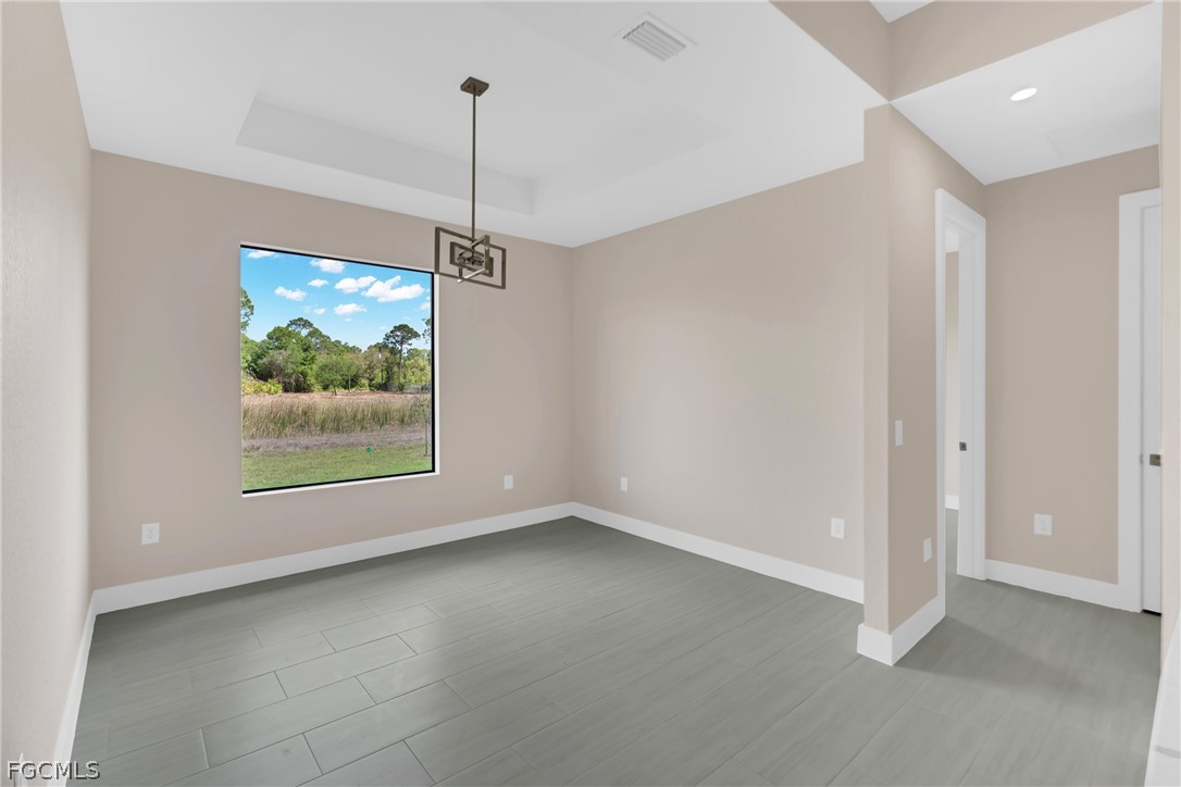 6029 Keystone Circle LaBelle, FL 33935 - Photo 21 of 50 a view of a room with window ceiling fan and hallway