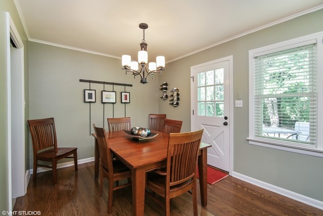1528 Sunset Ridge Road Glenview, IL 60025 - Photo 4 of 11 a view of a dining room with furniture window and wooden floor