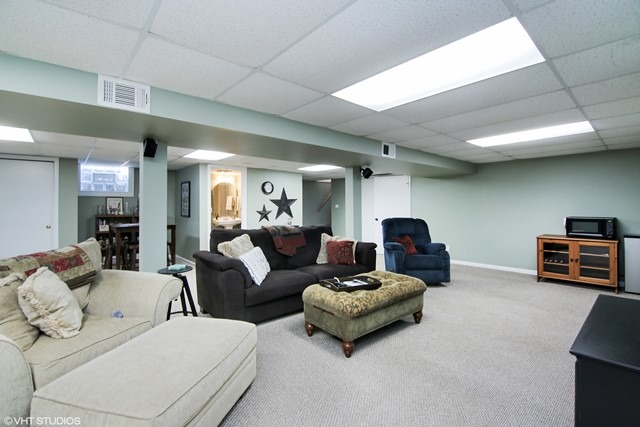 1528 Sunset Ridge Road Glenview, IL 60025 - Photo 6 of 11 a living room with furniture and a flat screen tv
