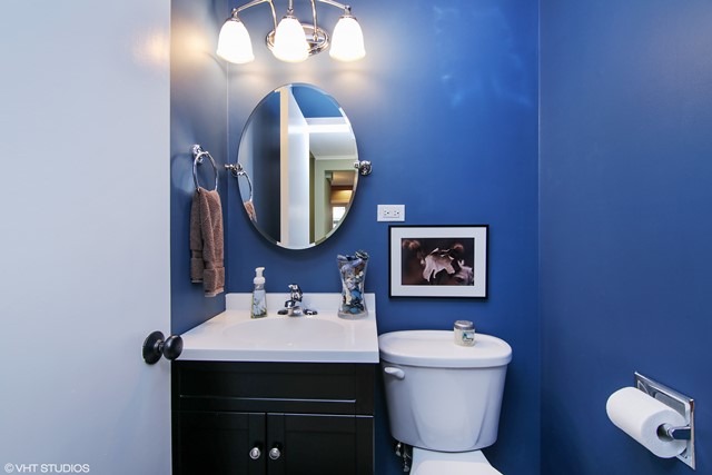 1528 Sunset Ridge Road Glenview, IL 60025 - Photo 10 of 11 a bathroom with a toilet sink and mirror