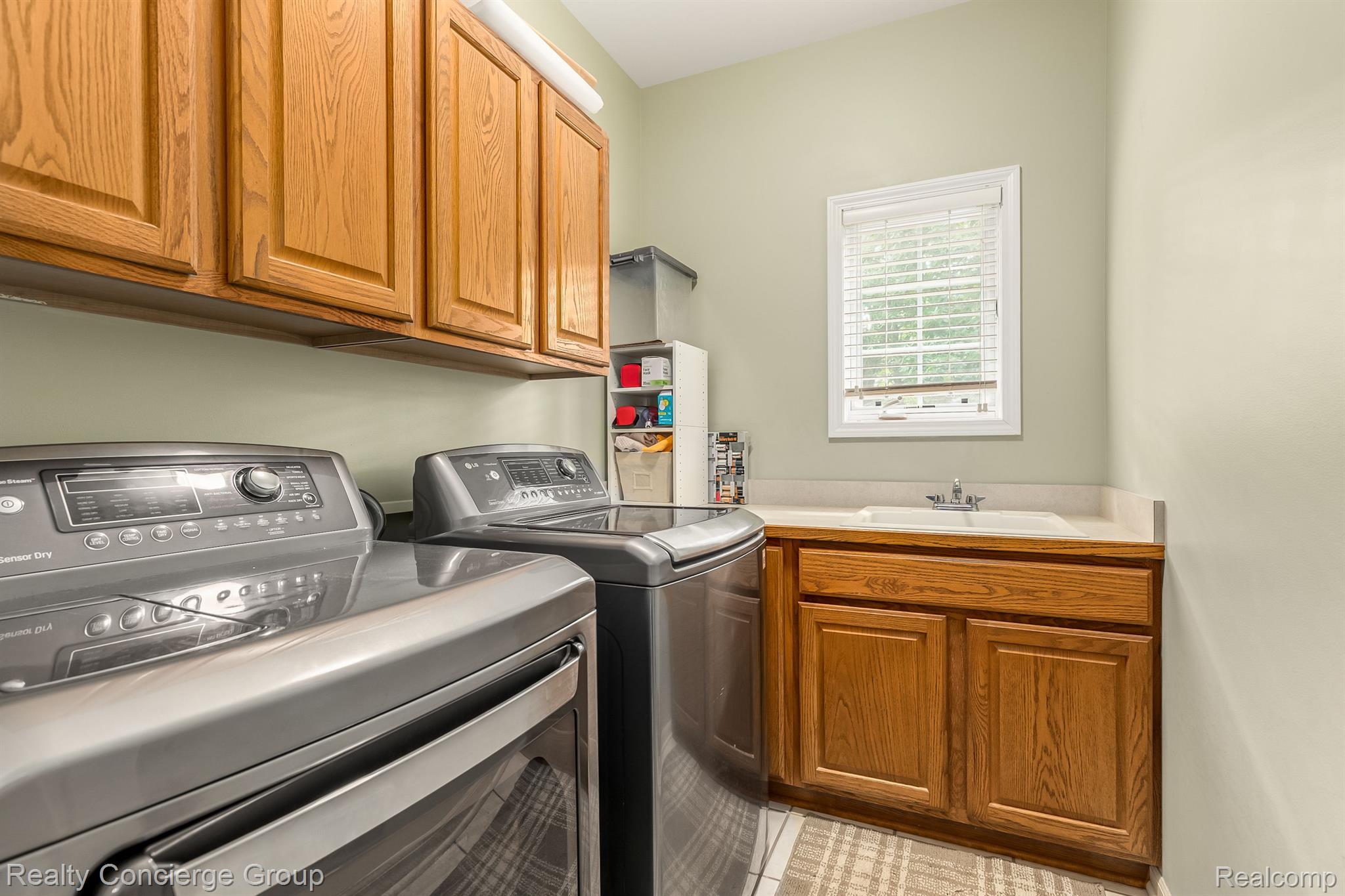 9761 Quail Ridge Run Brighton, MI 48114 - Photo 13 of 30 Laundry room offers tons of space for storage