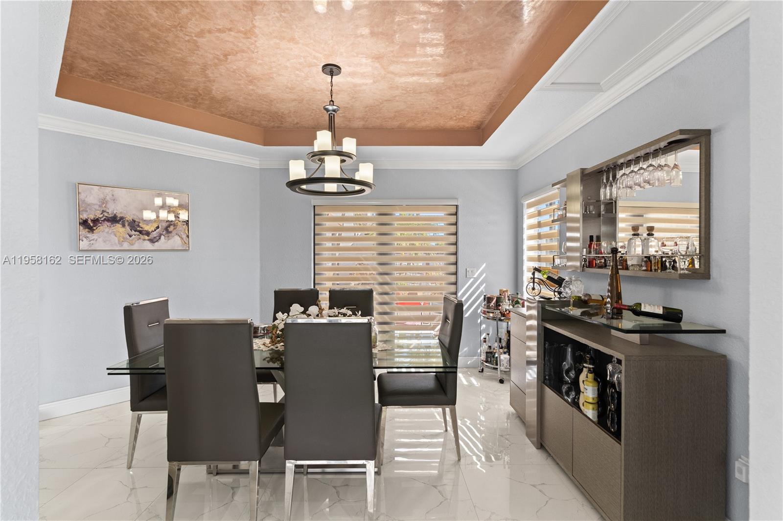 3281 Southwest 145th Avenue Miami, FL 33175 - Photo 12 of 56 a view of a dining room with furniture wooden floor and chandelier