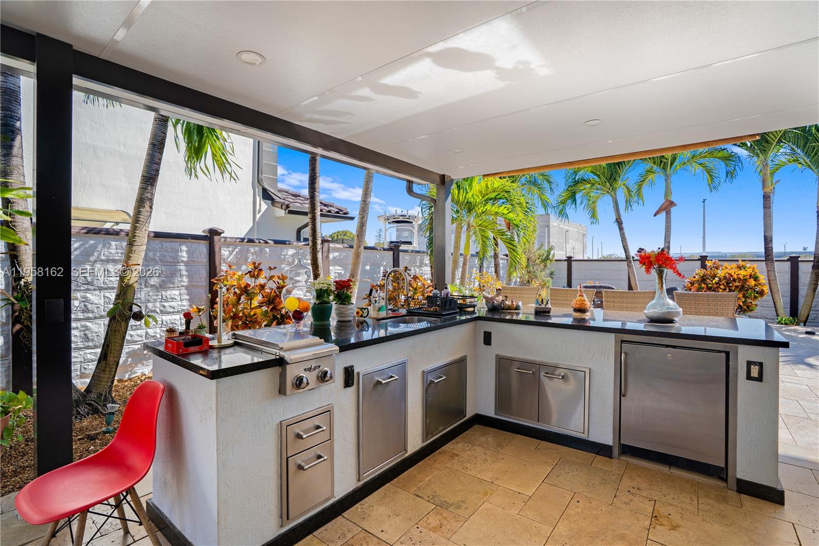 3281 Southwest 145th Avenue Miami, FL 33175 - Photo 25 of 56 a kitchen with stainless steel appliances a stove and cabinets