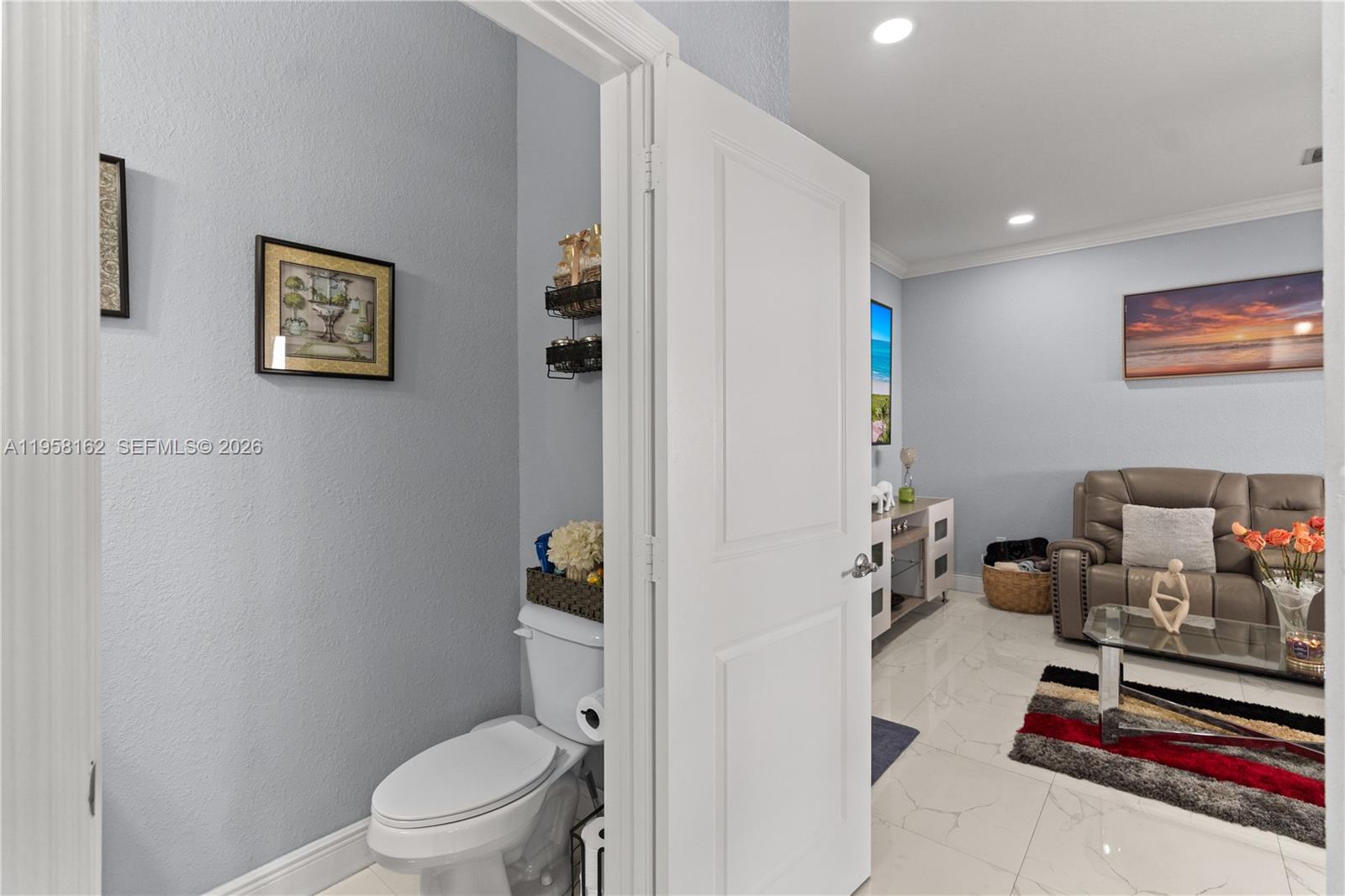 3281 Southwest 145th Avenue Miami, FL 33175 - Photo 32 of 56 a bathroom with a toilet and a shower