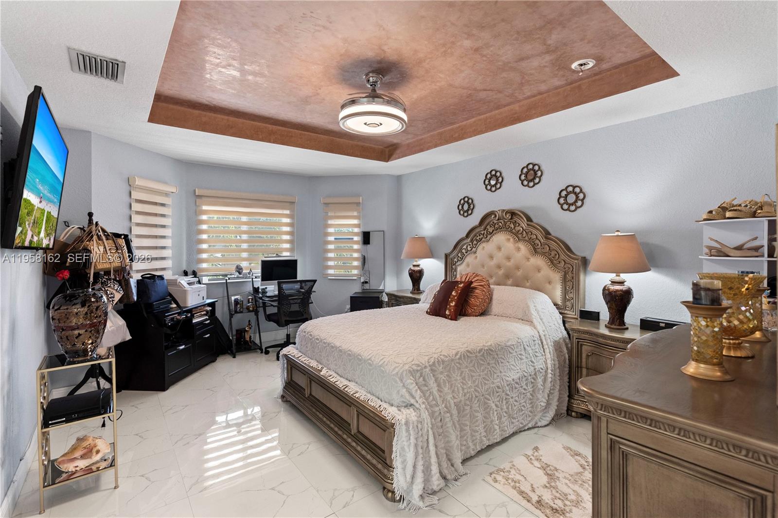 3281 Southwest 145th Avenue Miami, FL 33175 - Photo 38 of 56 a bedroom with a bed and a chandelier