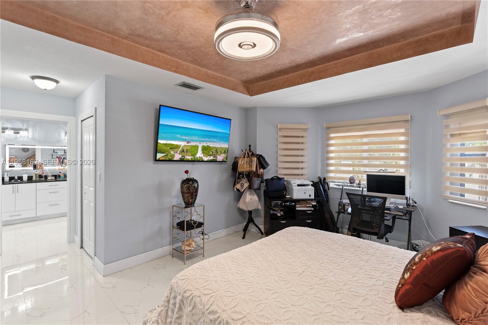 3281 Southwest 145th Avenue Miami, FL 33175 - Photo 40 of 56 a bedroom with a bed and wooden floor