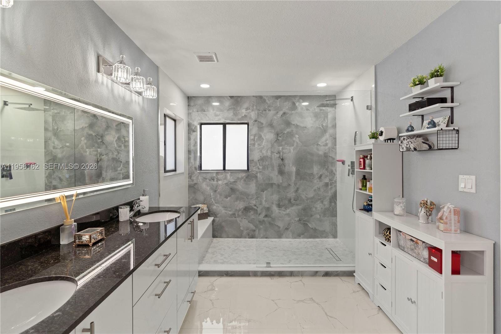 3281 Southwest 145th Avenue Miami, FL 33175 - Photo 42 of 56 a bathroom with a tub sink and mirror
