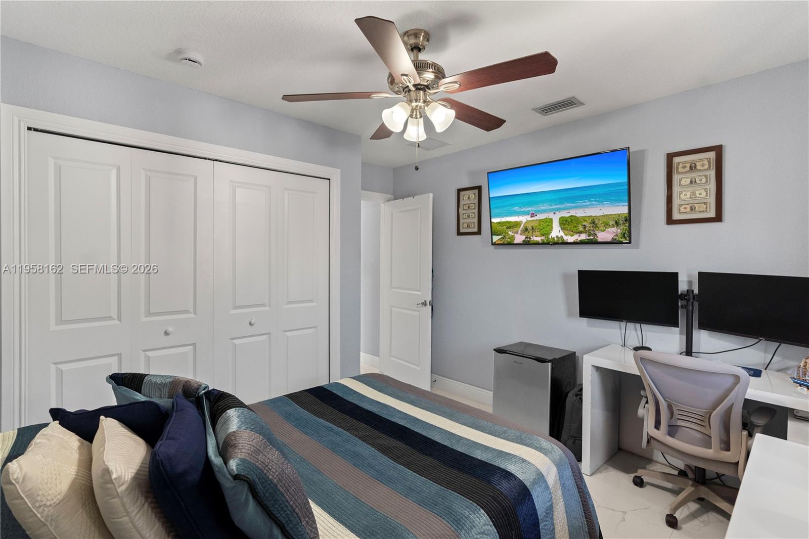 3281 Southwest 145th Avenue Miami, FL 33175 - Photo 48 of 56 a bedroom with a bed and a desk