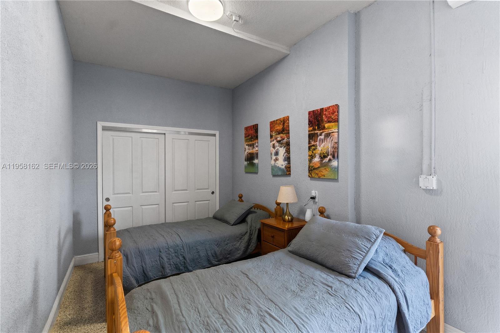 3281 Southwest 145th Avenue Miami, FL 33175 - Photo 54 of 56 a bedroom with a bed and a couch