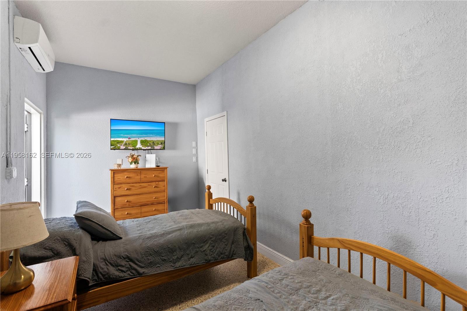 3281 Southwest 145th Avenue Miami, FL 33175 - Photo 55 of 56 a bedroom with two beds and painted walls