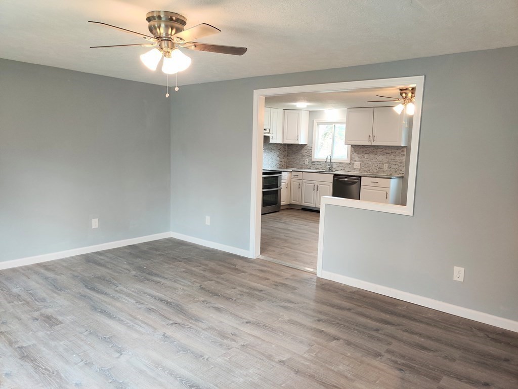 173 Wrentham Road Springfield, MA 01119 - Photo 8 of 15 wooden floor in an empty room with a window