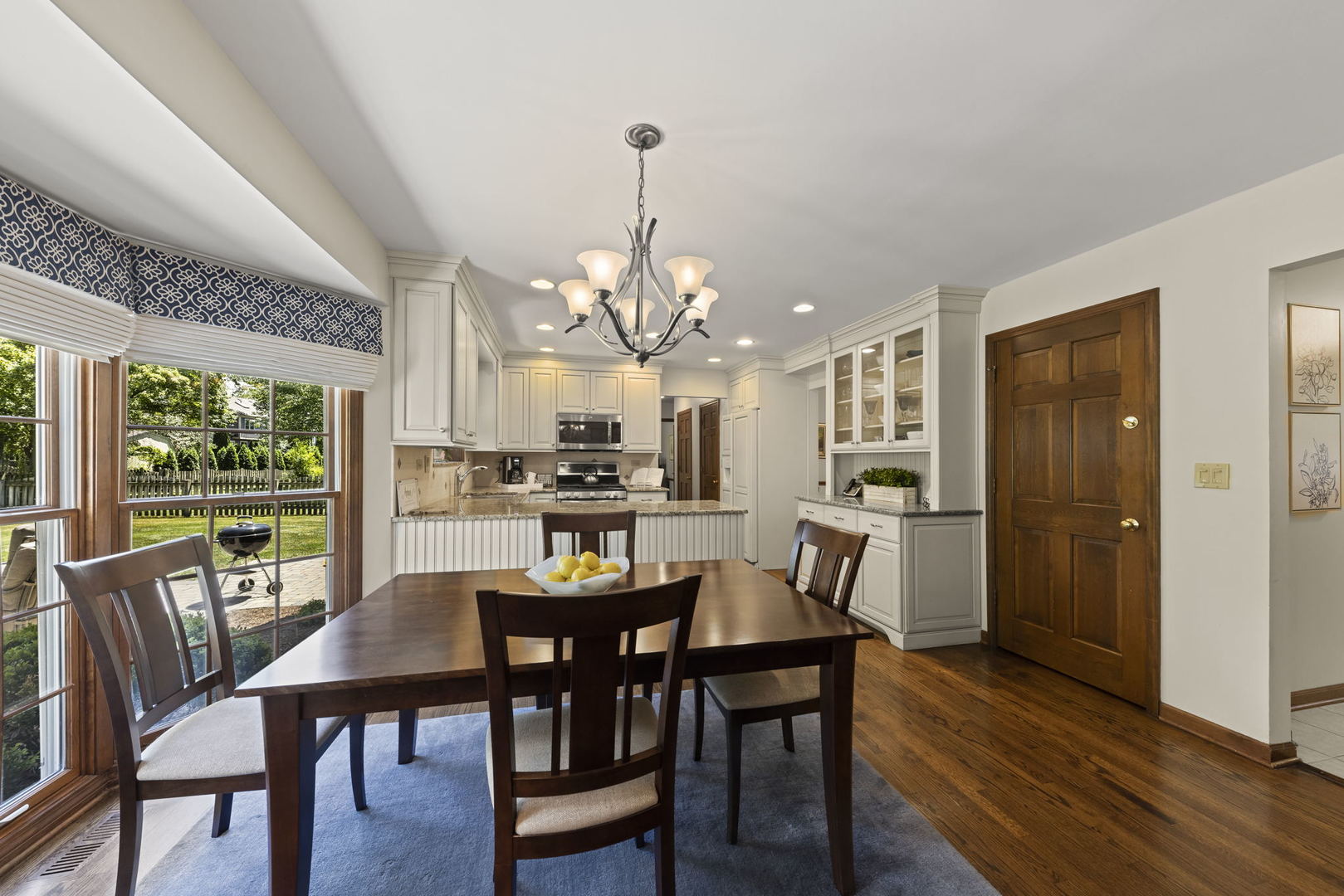 2037 Burnham Place Wheaton, IL 60189 - Photo 11 of 46 a view of a dining room with furniture window and wooden floor