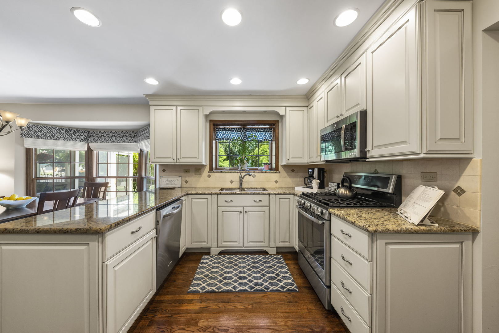 2037 Burnham Place Wheaton, IL 60189 - Photo 2 of 46 a kitchen with stainless steel appliances granite countertop a stove a sink and a microwave