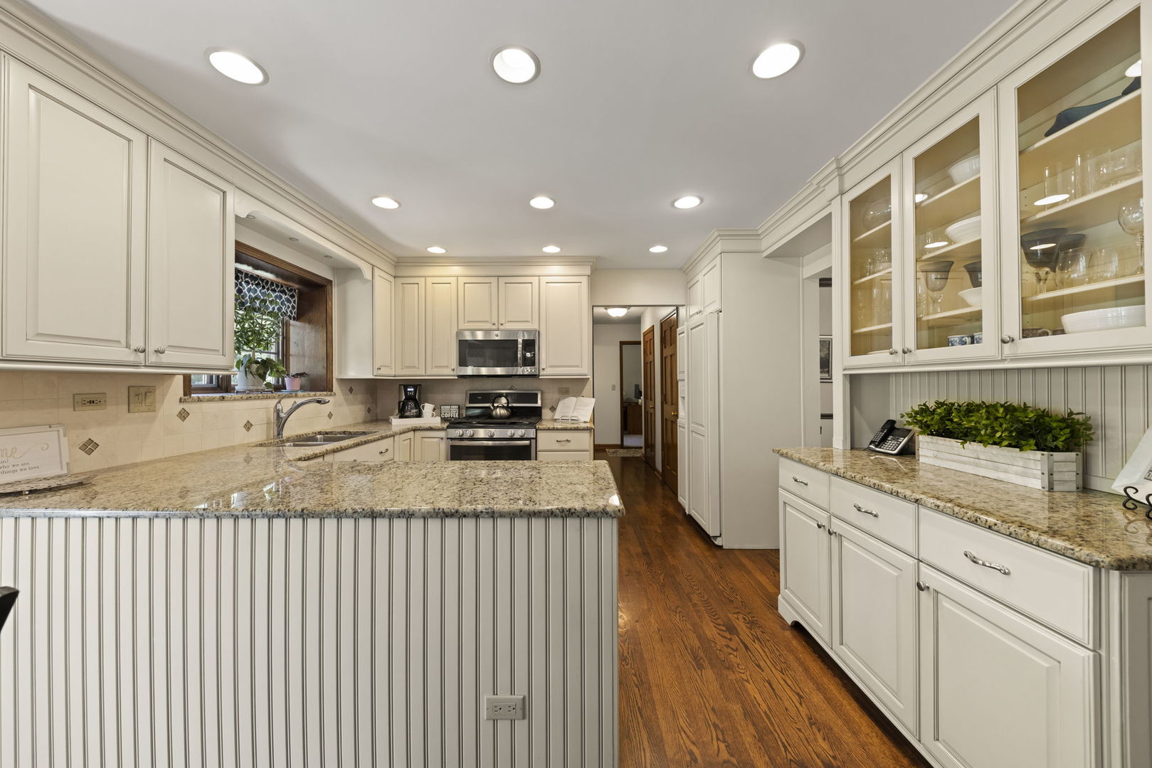 2037 Burnham Place Wheaton, IL 60189 - Photo 3 of 46 a kitchen with stainless steel appliances granite countertop a refrigerator a sink dishwasher a stove and white countertops with wooden floor