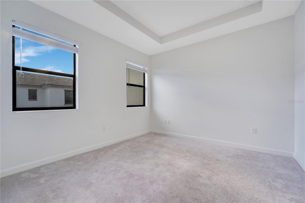28517 Southwest 134th Avenue Homestead, FL 33033 - Photo 11 of 34 a view of an empty room with window and wooden floor