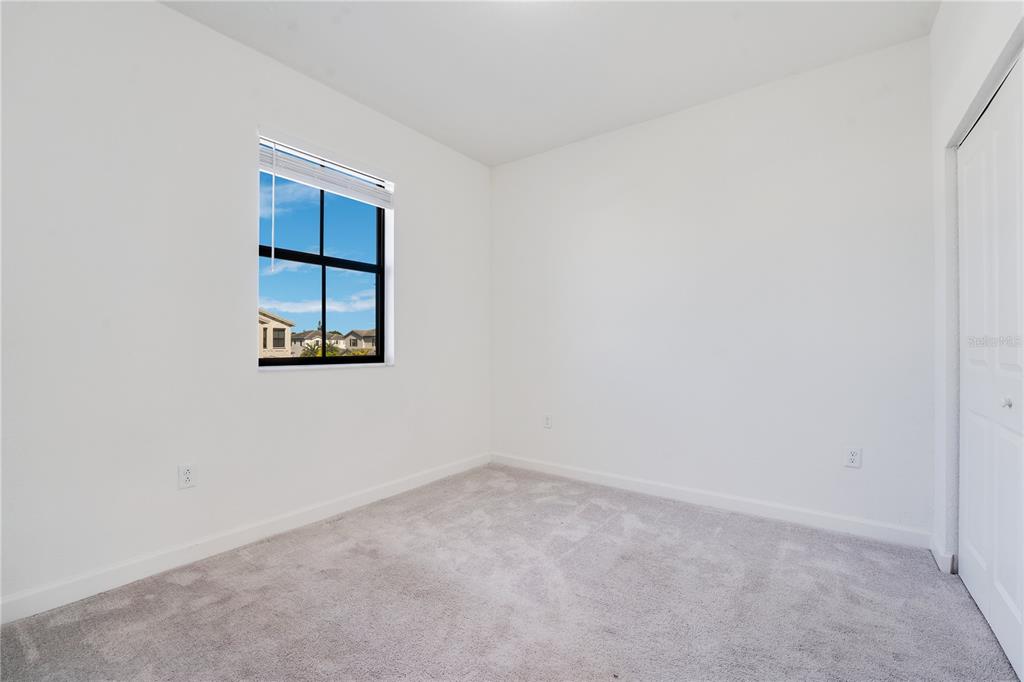 28517 Southwest 134th Avenue Homestead, FL 33033 - Photo 15 of 34 an empty room with a window
