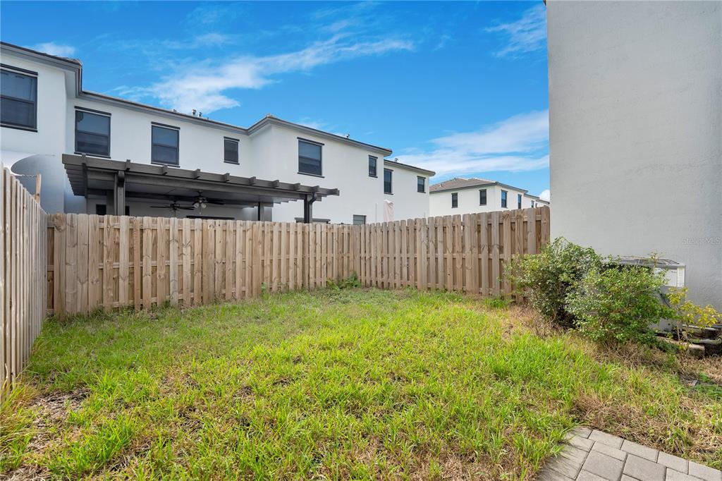 28517 Southwest 134th Avenue Homestead, FL 33033 - Photo 23 of 34 a view of a house with wooden fence