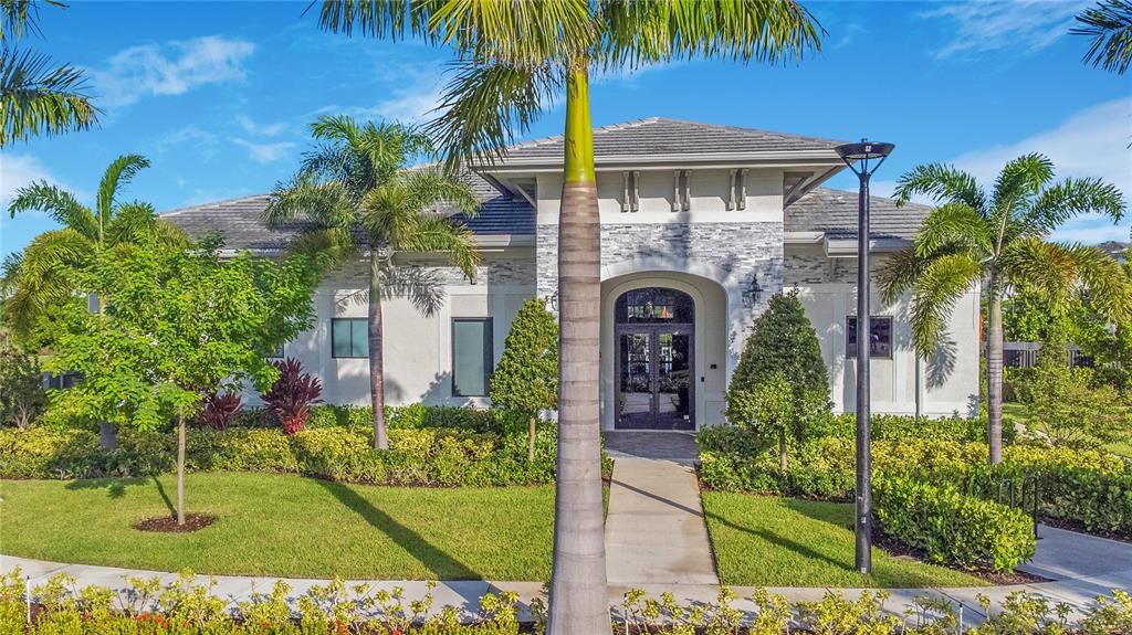 28517 Southwest 134th Avenue Homestead, FL 33033 - Photo 28 of 34 a front view of a house with a garden
