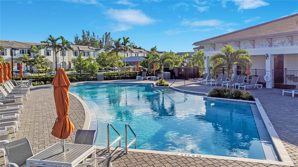 28517 Southwest 134th Avenue Homestead, FL 33033 - Photo 29 of 34 a view of a swimming pool with sitting area