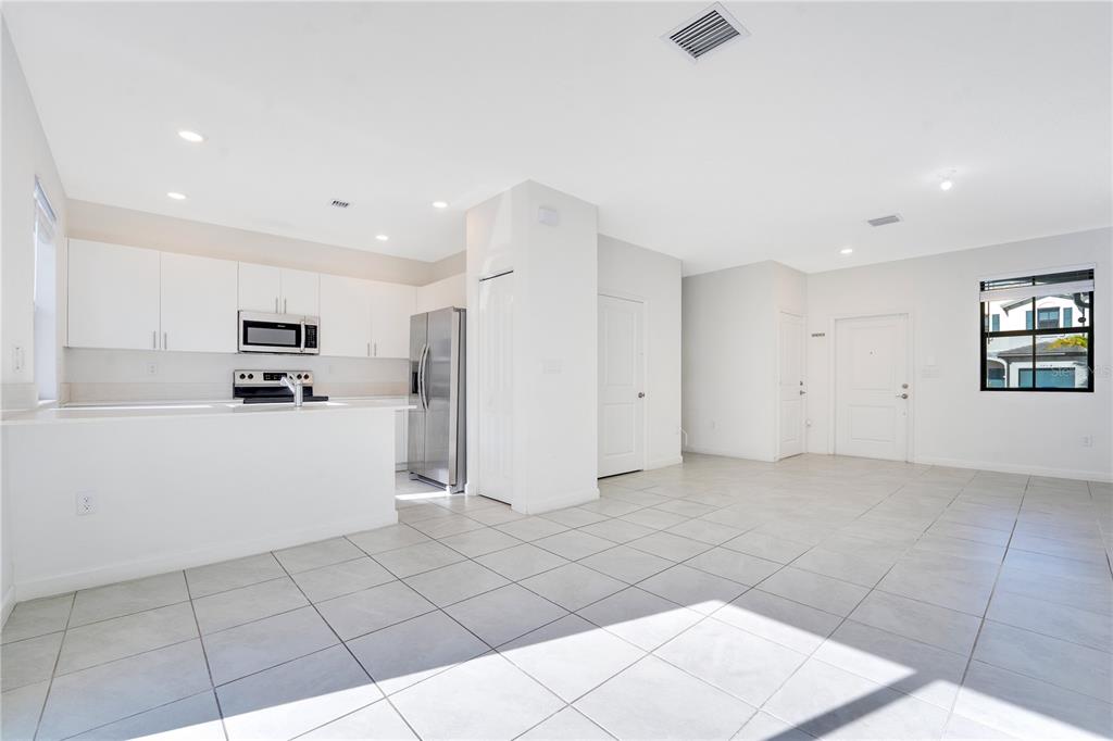 28517 Southwest 134th Avenue Homestead, FL 33033 - Photo 3 of 34 a kitchen with cabinets and a refrigerator