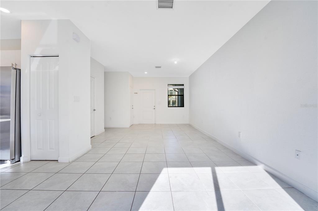 28517 Southwest 134th Avenue Homestead, FL 33033 - Photo 4 of 34 a view of an empty room with a window