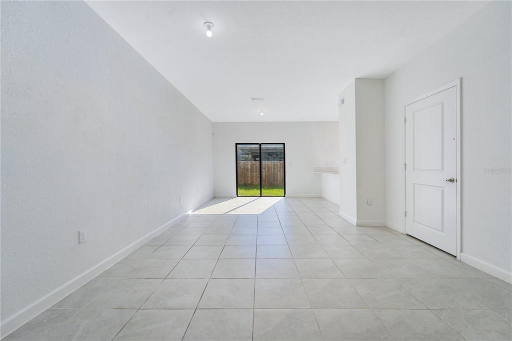 28517 Southwest 134th Avenue Homestead, FL 33033 - Photo 6 of 34 a view of an empty room with a window
