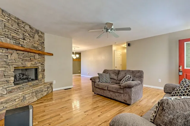 a kitchen with stainless steel appliances granite countertop a refrigerator a stove top oven a sink and dishwasher