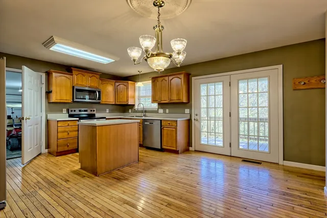 a bathroom with a sink a mirror and vanity