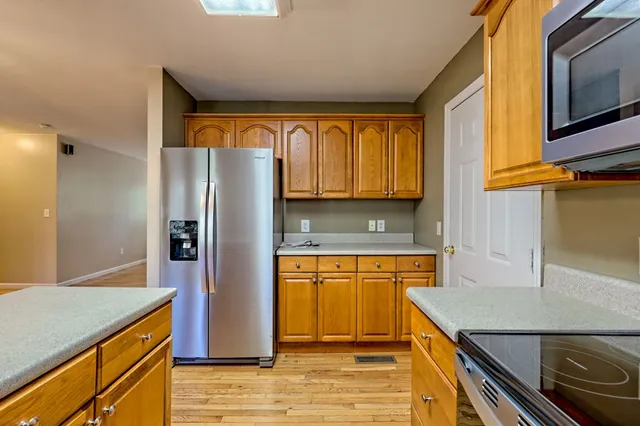 a view of house with backyard and trees