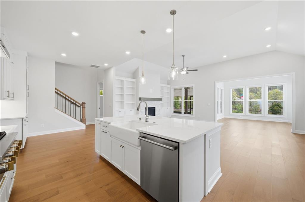 250 Idylwilde Way Canton, GA 30115 - Photo 16 of 59 a large white kitchen with a large window and stainless steel appliances