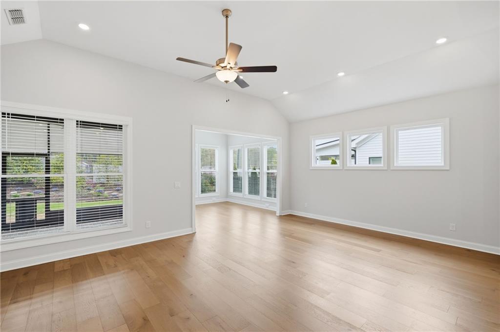 250 Idylwilde Way Canton, GA 30115 - Photo 21 of 59 a view of an empty room with a window and wooden floor