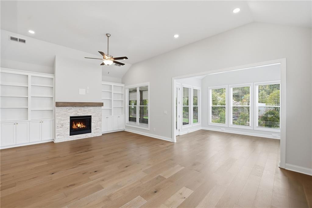 250 Idylwilde Way Canton, GA 30115 - Photo 23 of 59 a view of a livingroom with fireplace wooden floor and window