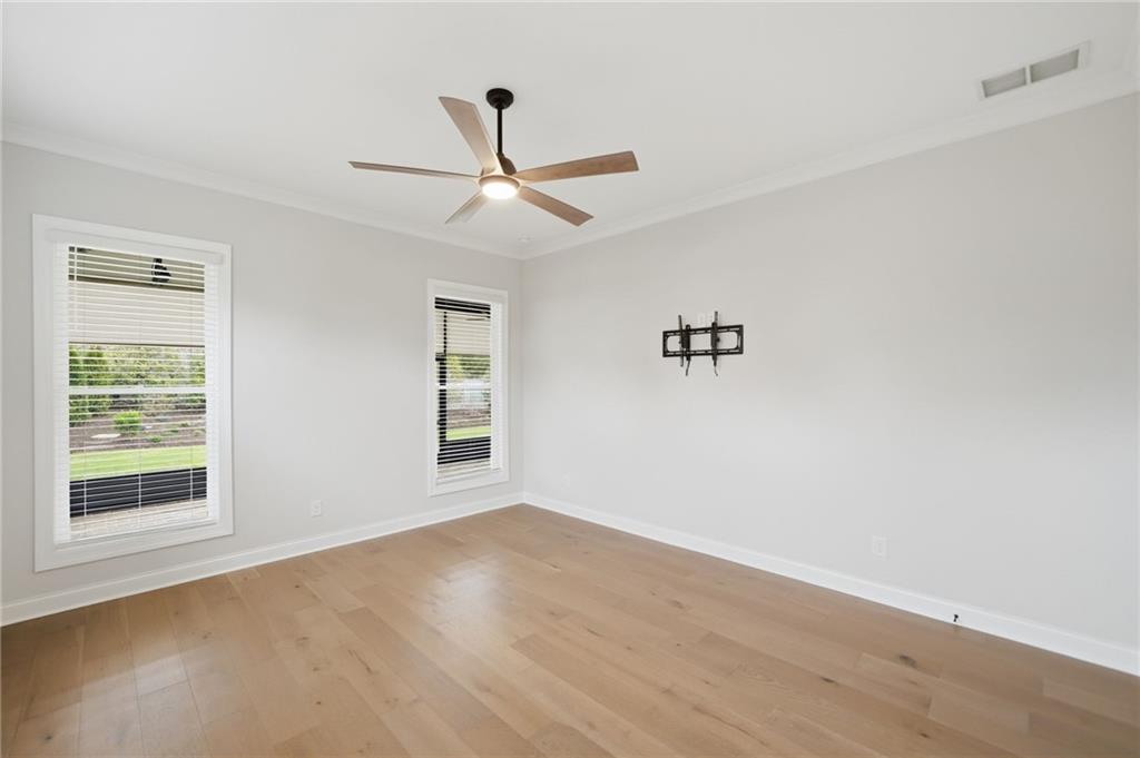250 Idylwilde Way Canton, GA 30115 - Photo 29 of 59 a view of an empty room with a window and wooden floor