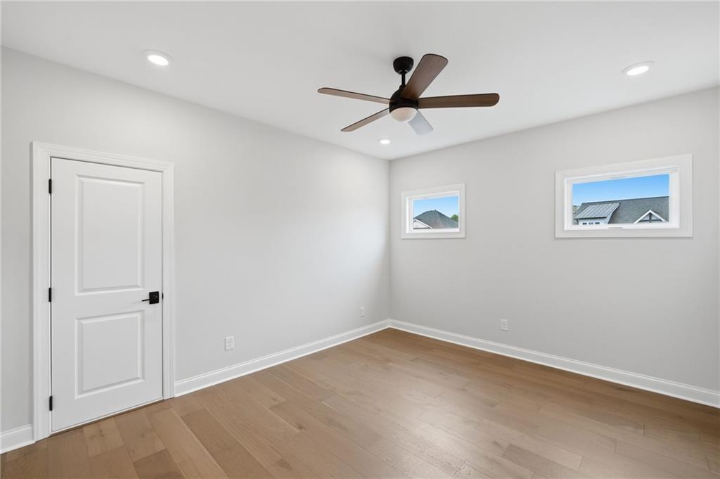 250 Idylwilde Way Canton, GA 30115 - Photo 37 of 59 a view of a big room with wooden floor closet and windows