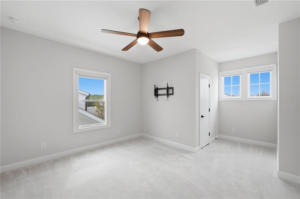 250 Idylwilde Way Canton, GA 30115 - Photo 40 of 59 a view of empty room with ceiling fan