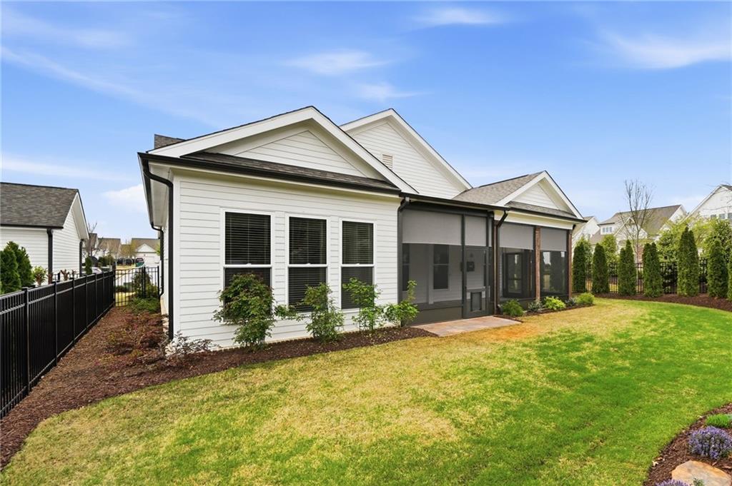 250 Idylwilde Way Canton, GA 30115 - Photo 50 of 59 a front view of a house with a yard outdoor seating and garage
