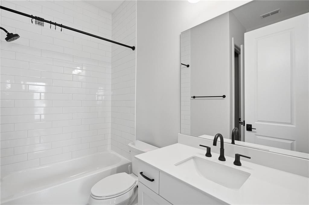 250 Idylwilde Way Canton, GA 30115 - Photo 7 of 59 a bathroom with a sink toilet and shower